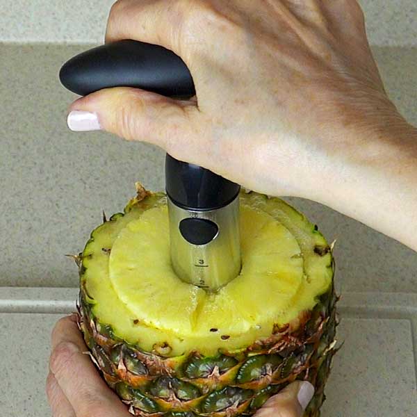 Shows you stop turning corer when you reach the bottom of the pineapple