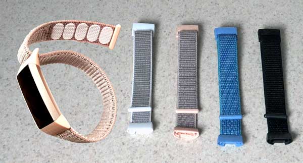 Velcro Wrist Bands in various colors pictured with a Fit Bit