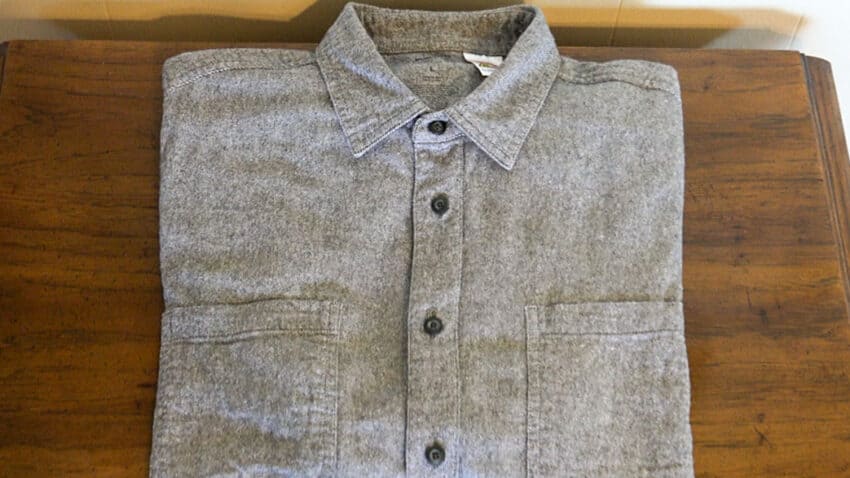 Magnetic button shirt folded on a table for easier dressing and adaptive clothing needs